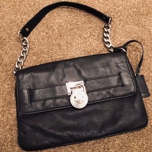 Michael Kors black leather with silver clutch